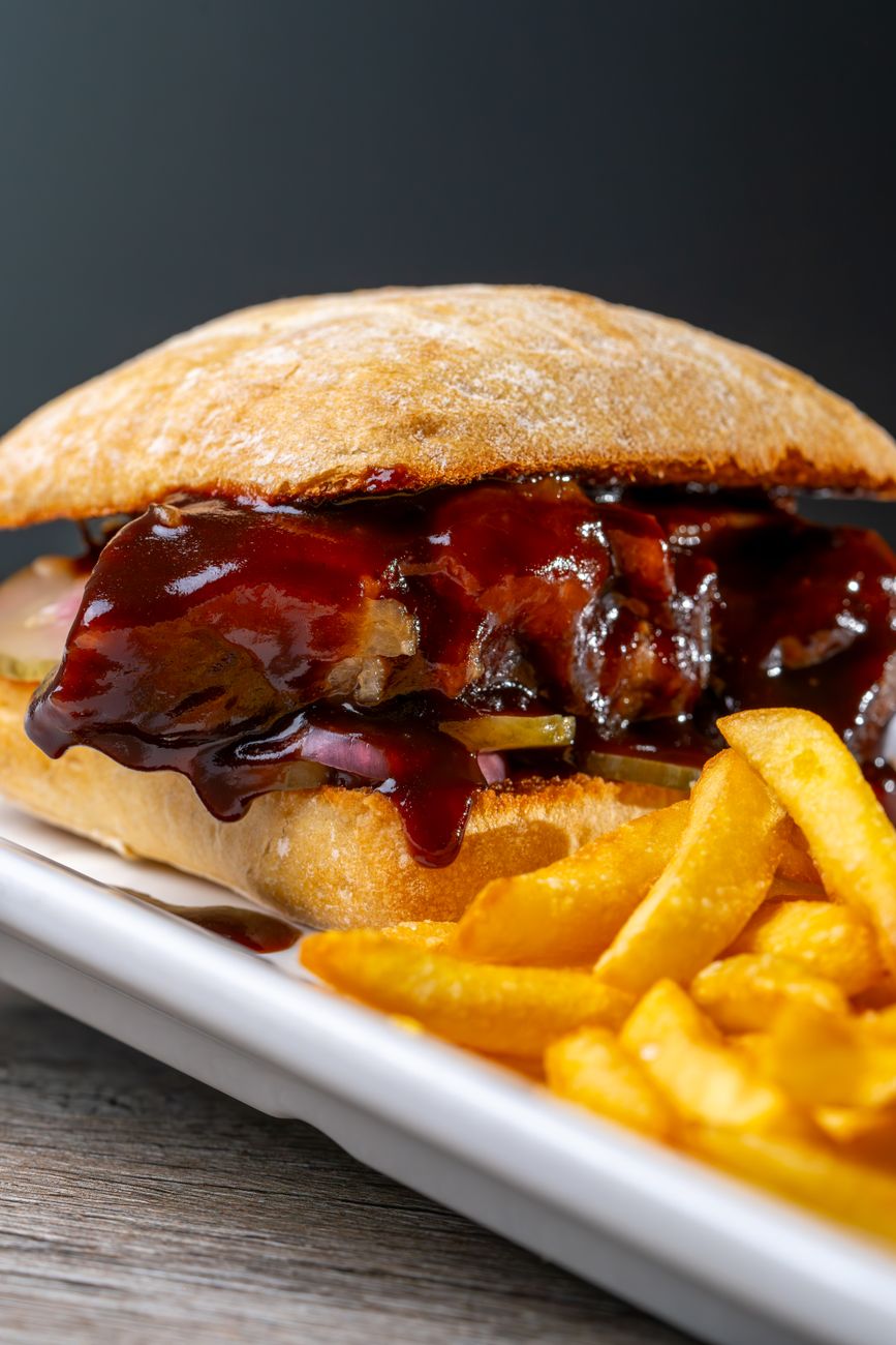 A barbecue sandwich with fries