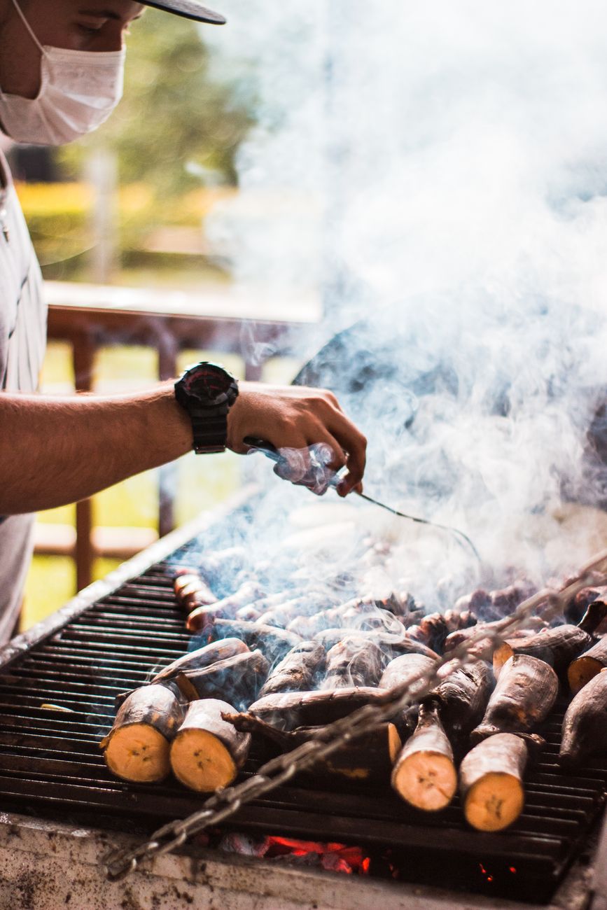 A pitmaster tending the smoker